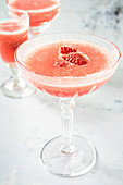 Frozen rosé wine with raspberry syrup and raspberries
