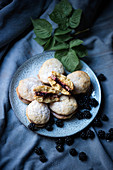 Vegan whoopie pies filled with blackberry sauce and chocolate cream