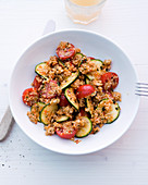 Couscous and vegetable salad with courgette and cocktail tomatoes