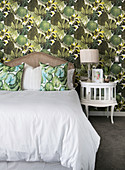 Wallpaper with pattern of tropical leaves in classic bedroom