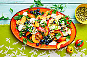 Summer salad of peaches and blueberries