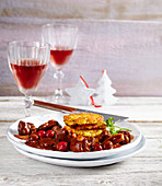 Wild boar goulash with cranberries and potato-sweet-potato fritters