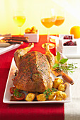 Roast goose with a chestnut and quince filling and potato-pistachio fritters