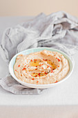 Hummus (paste made of chickpeas and tahini) with sun dried tomatoes