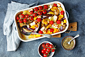 Aaubergine, potatoes, tomatoes, onion and pumkin, baked with feta