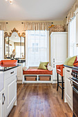 Window seat in country-house-style kitchen-dining room