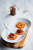 Roasted sweet potato slices with carrot and onion chutney
