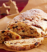 Sweet fruit and nut bread with dried fruit on baking paper