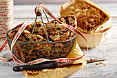 Mini fruit bread in a metal basket and a wooden basket