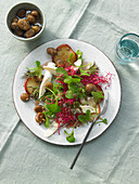 Purslane with fried apple, goat's cheese, beetroot shoots and chestnuts in honey