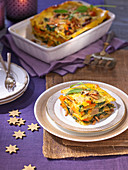 Spinach and pumpkin lasagna with orange and mustard sauce for Christmas