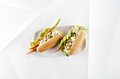 Vegetarian carrot hot dogs with celery mousse