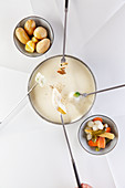 Cheese fondue with various vegetables