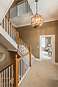 Staircase with wooden balustrades in house with several stories