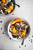Persimmon porridge with pomegranate, coconut, and seeds
