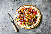 Tart with Heirloom Tomato and Ricotta on a gray background