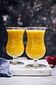 Golden milk smoothie in two glasses
