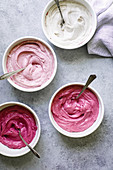 Pink frosting in bowls