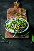 Gluten free spaghetti with snap peas, basil, and thyme.