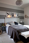 Wall decorated with wide horizontal stripes in shades of grey