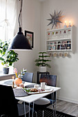 Dining table in black-and-white kitchen-dining room