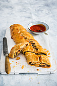 Aubergine pastry roll with tomato sauce