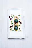 Scallops with gratinated horenso spinach cake and anchovy and lime aioli