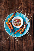 Grilled king prawn skewers with a sweet and spicy tomato dip