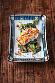 Red snapper with a sweet potato and coconut crust on bok choy