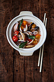 Mussels in a clear tomato broth with Thai basil