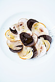 Mushroom carpaccio with summer ceps, Caesar mushrooms, button mushrooms and black truffles
