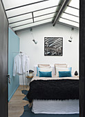 Pale blue bedroom in former textile factory