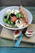 Autumnal salad with Brussels sprouts, mushrooms, figs, bacon and feta cheese