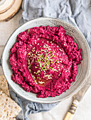 Vegan roasted beetroot white bean hummus and sprouts