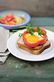 Pepper fried eggs on toast with carrot and cucumber salad
