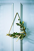 Christmas wreath made of brass triangle