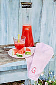 Watermelon juice in a glass and a glass jug