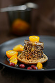 Upside down chocolate souffle with kumquat compote