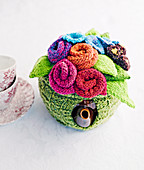 Flower-shaped, knitted warmer for teapot