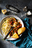Vegetarian mushroom bolognese served with linguine, fresh chives and parmesan cheese in a large pasta bowl
