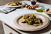 Sautéed mushrooms with olive oil, broccoli and pumpkin seeds