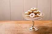 Linzer cookies on a cake stand