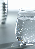 A glass of water with bubbles