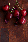 Fresh cherries on a wooden surface