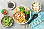 Ramen with chicken, egg, wakame, leek, peas and bok choy