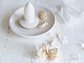 Garlic cloved in a porcelain flat mortar with spear pestle