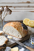 A white, home made loaf, flavoured with Amalfi lemon and poppy seeds