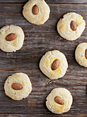 Almond biscuits on a wooden background (top view)