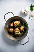 Mushrooms stuffed with lentil chilli, gratinated with substitute cheese (vegan)