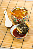 Miso soup served with mochi wrapped in nori (Japan)